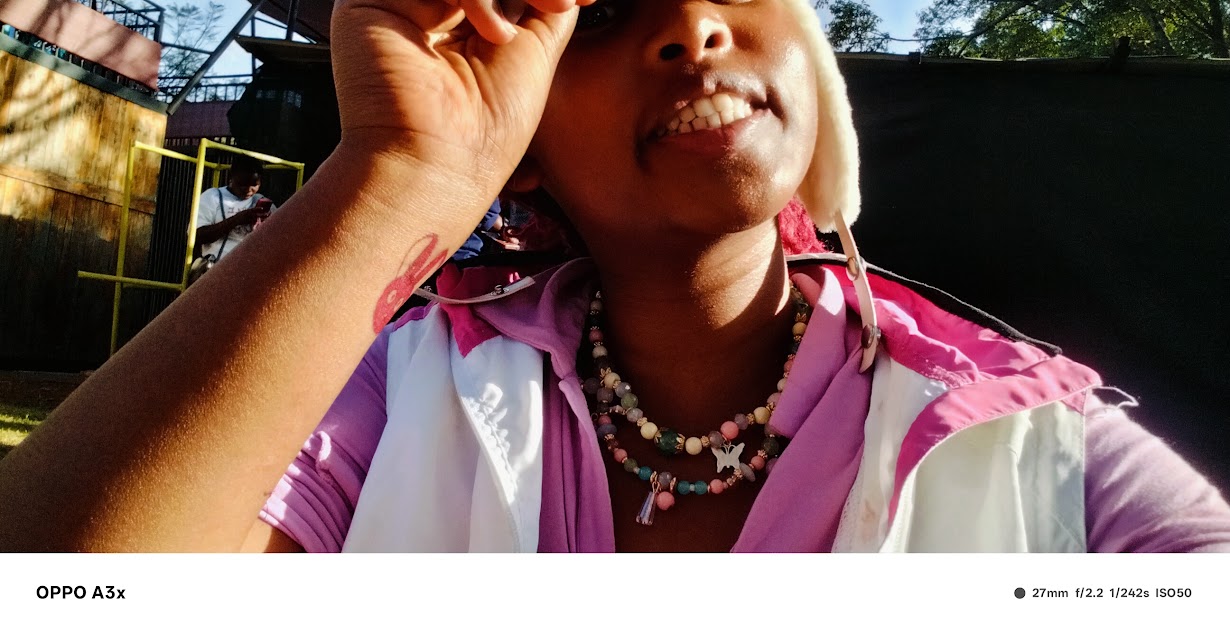Juanita in pink and purple in the sunshine